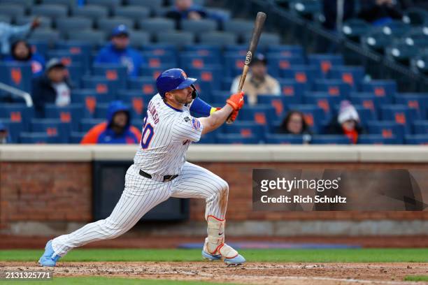 Pete Alonso of the New York Mets hits a home run against the Detroit Tigers to tie the game in the ninth inning in game two of a double header at...