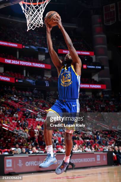 Andrew Wiggins of the Golden State Warriors dunks the ball during the game against the Houston Rockets on April 4, 2024 at the Toyota Center in...