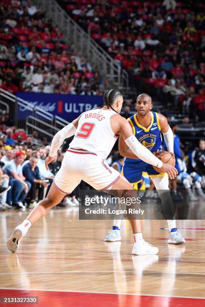 Dillon Brooks of the Houston Rockets plays defense against Chris Paul of the Golden State Warriors during the game on April 4, 2024 at the Toyota...