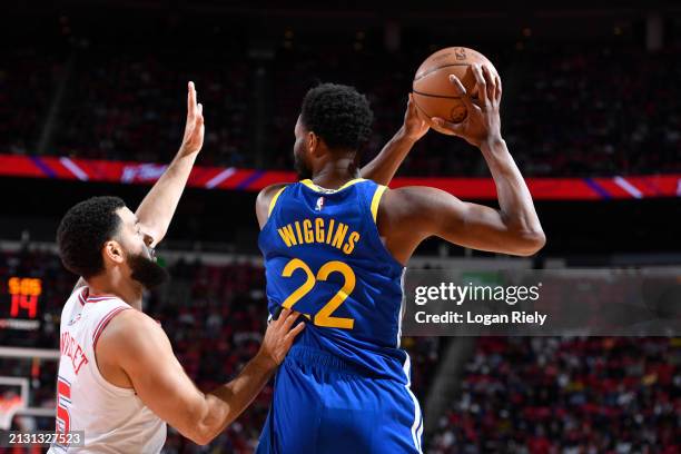 Andrew Wiggins of the Golden State Warriors handles the ball against Fred VanVleet of the Houston Rockets during the game on April 4, 2024 at the...