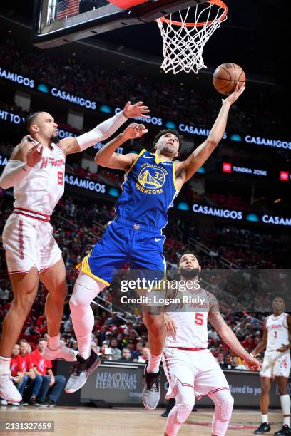 Trayce Jackson-Davis of the Golden State Warriors shoots the ball during the game against the Houston Rockets on April 4, 2024 at the Toyota Center...