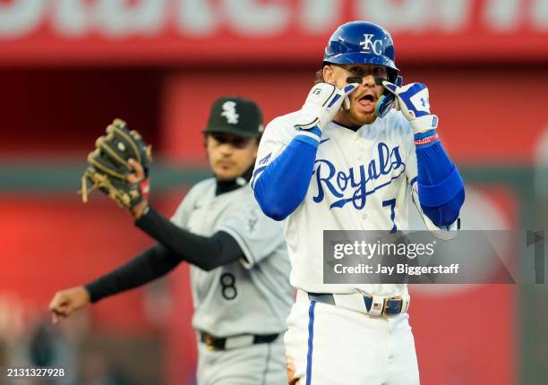 Bobby Witt Jr. #7 of the Kansas City Royals gestures to the dugout after hitting a double during the third inning against the Chicago White Sox at...