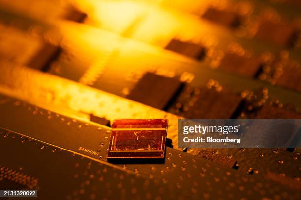 Samsung Electronics Co. 12-layer HBM3E, top, and other DDR modules arranged in Seoul, South Korea, on Thursday, April 4, 2024. Samsung's profit...