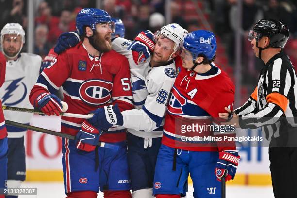 Steven Stamkos of the Tampa Bay Lightning is caught between David Savard and Brendan Gallagher of the Montreal Canadiens during the third period at...