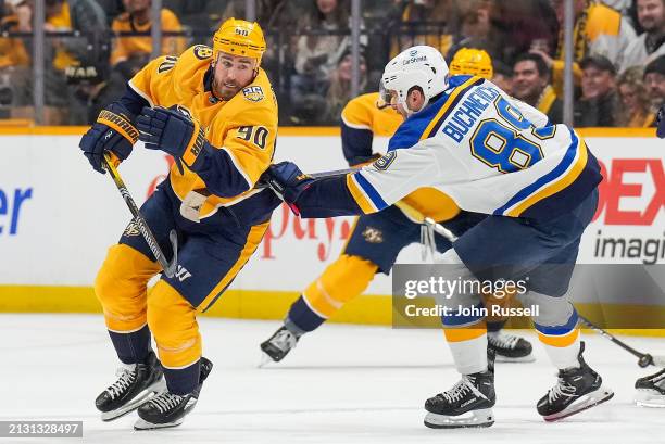 Ryan O'Reilly of the Nashville Predators skates against Pavel Buchnevich of the St. Louis Blues during an NHL game at Bridgestone Arena on April 4,...