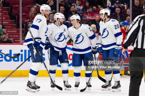 The Tampa Bay Lightning celebrate after scoring a goal during the second period of the NHL regular season game between the Montreal Canadiens and the...