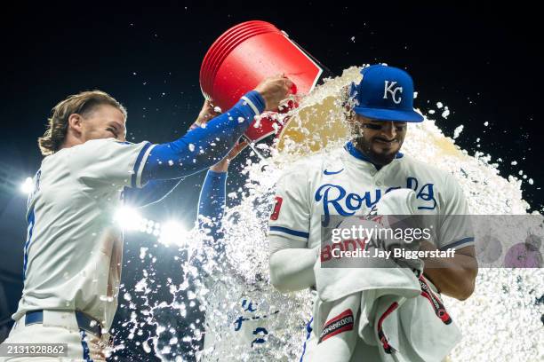 Melendez of the Kansas City Royals is doused with water by Bobby Witt Jr. #7 and Kyle Isbel after defeating the Chicago White Sox at Kauffman Stadium...