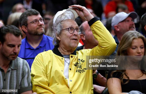 Actor Chevy Chase watches the game between the Dallas Mavericks and the Atlanta Hawks in the second half at American Airlines Center on April 4, 2024...