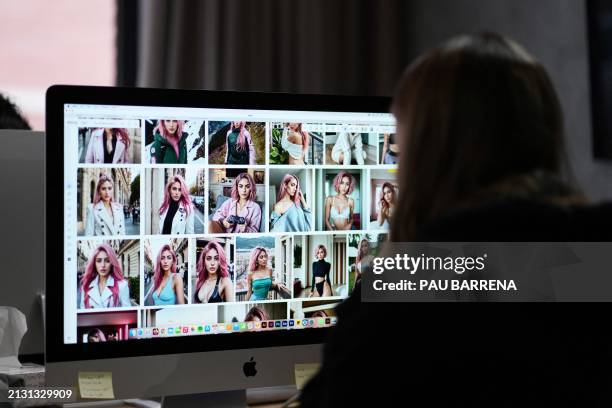 Spanish co-founder and creative director at The Clueless agency Diana Nunez, works on her computer on artificial intelligence generated images of...