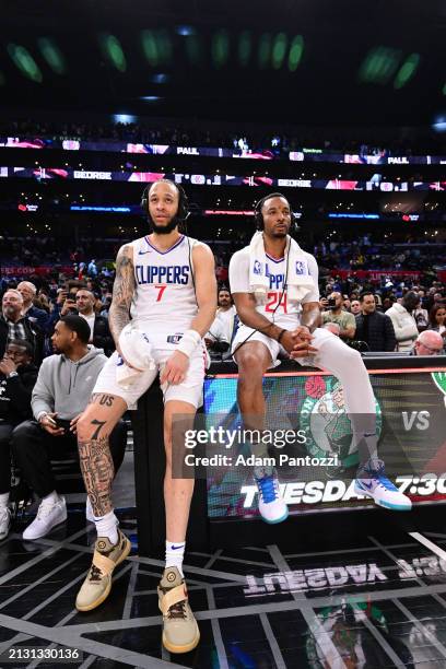 Amir Coffey and Norman Powell of the LA Clippers talks to the media after the game against the Denver Nuggets on April 4, 2024 at Crypto.Com Arena in...