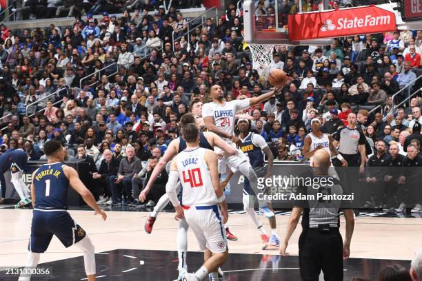 Norman Powell of the LA Clippers drives to the basket during the game against the Denver Nuggets on April 4, 2024 at Crypto.Com Arena in Los Angeles,...