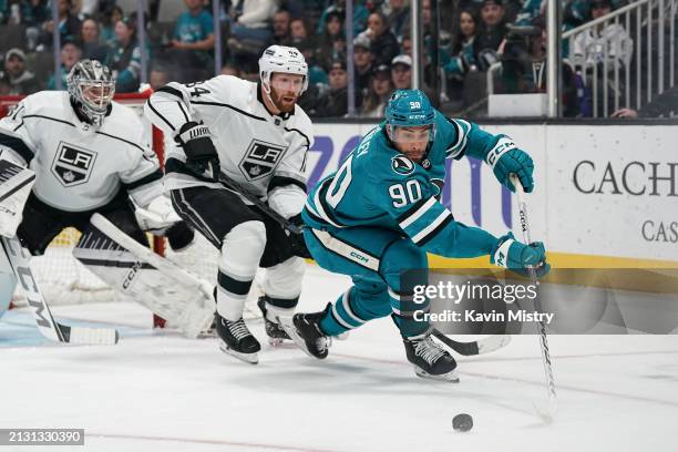 Justin Bailey of the San Jose Sharks skates with the puck in the second period against Vladislav Gavrikov of the Los Angeles Kings at SAP Center on...