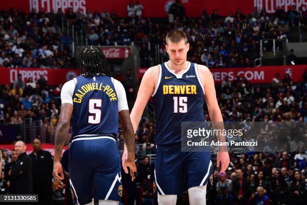 Kentavious Caldwell-Pope and Nikola Jokic of the Denver Nuggets look on during the game against the LA Clippers on April 4, 2024 at Crypto.Com Arena...