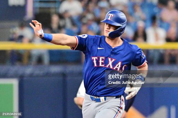 Josh Jung of the Texas Rangers waves to fans after hitting a three-run home run in the first inning against the Tampa Bay Rays at Tropicana Field on...