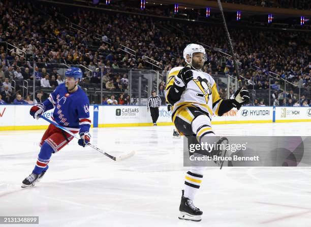 Bryan Rust of the Pittsburgh Penguins celebrates his goal against the New York Rangers at 18 seconds of the first period at Madison Square Garden on...