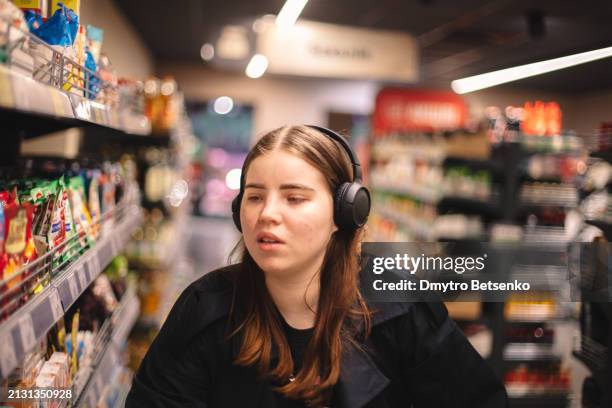 young woman shopping in the supermarket - ukraine people stock pictures, royalty-free photos & images