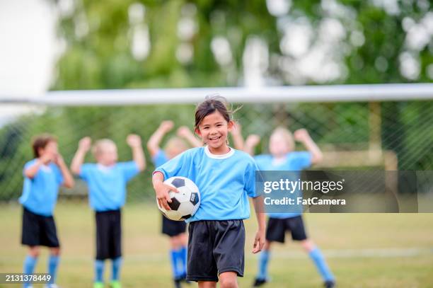 playing as a team - kids soccer stock pictures, royalty-free photos & images