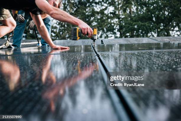 solar panel installation in the pacific northwest - power tool stock pictures, royalty-free photos & images