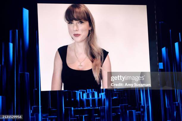 Taylor Swift is seen onscreen during the 2024 iHeartRadio Music Awards at Dolby Theatre on April 01, 2024 in Hollywood, California.