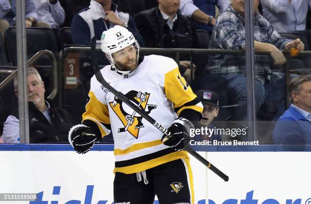 Bryan Rust of the Pittsburgh Penguins celebrates his empty net goal against the New York Rangers at Madison Square Garden on April 01, 2024 in New...