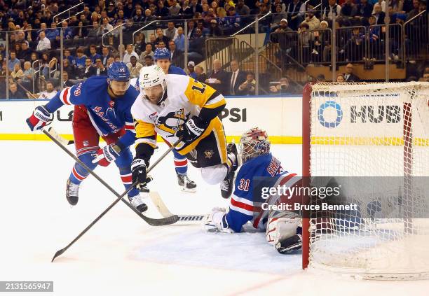 Igor Shesterkin of the New York Rangers makes the second period save on Bryan Rust of the Pittsburgh Penguins at Madison Square Garden on April 01,...