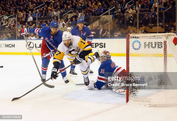 Igor Shesterkin of the New York Rangers makes the second period save on Bryan Rust of the Pittsburgh Penguins at Madison Square Garden on April 01,...