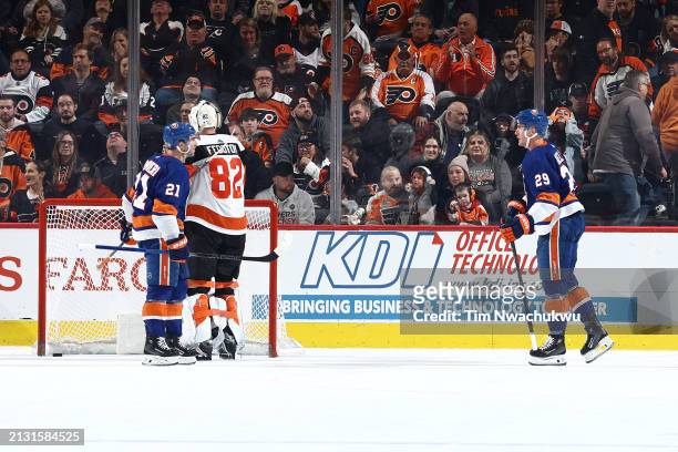 Kyle Palmieri and Brock Nelson of the New York Islanders react following a goal by Nelson past Ivan Fedotov of the Philadelphia Flyers during...