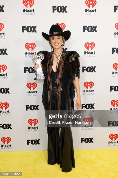 Lainey Wilson, winner of the Country Song of the Year Award for “Heart Like a Truck,” poses in the press room during the 2024 iHeartRadio Music...