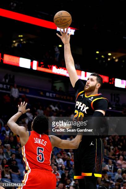 Jusuf Nurkic of the Phoenix Suns shoots over Herbert Jones of the New Orleans Pelicans during the third quarter of an NBA game at Smoothie King...