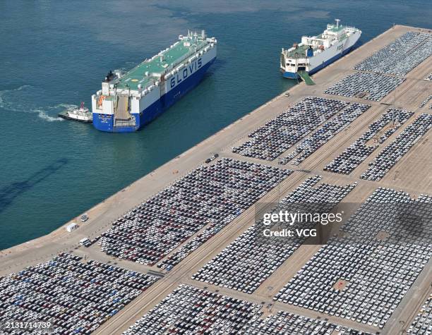 Aerial view of cars waiting to be shipped aboard at Yantai Port on April 1, 2024 in Yantai, Shandong Province of China. China's automobile exports...