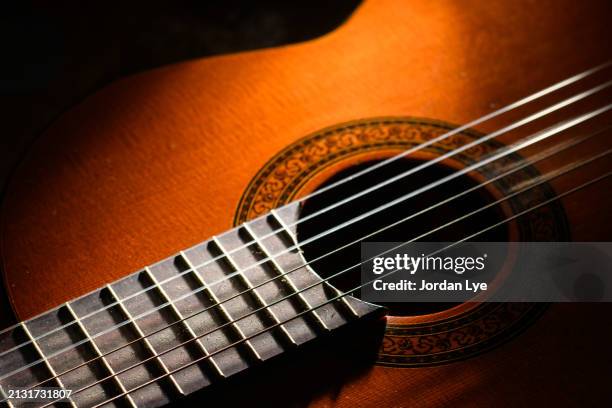 close-up of a classical guitar body - akustikgitarre stock-fotos und bilder