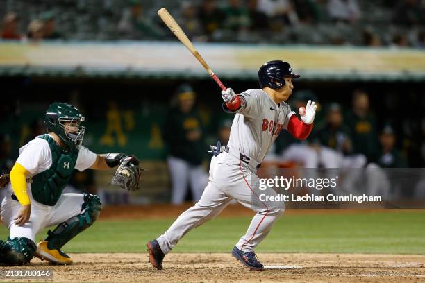 Masataka Yoshida of the Boston Red Sox grounds into a force out in the top of the sixth inning against the Oakland Athletics at Oakland Coliseum on...