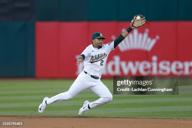 Darell Hernaiz of the Oakland Athletics attempts to field the ball in the top of the first inning against the Boston Red Sox at Oakland Coliseum on...