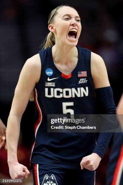 Paige Bueckers of the Connecticut Huskies yells after a play during the first half against the USC Trojans in the Elite 8 round of the NCAA Women's...