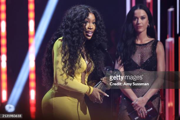 Accepts the Song of the Year Award for "Kill Bill" onstage from Katy Perry during the 2024 iHeartRadio Music Awards at Dolby Theatre on April 01,...