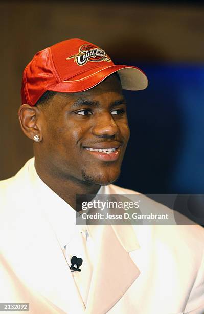 LeBron James who was selected by the Cleveland Cavaliers looks on during the 2003 NBA Draft at the Paramount Theatre at Madison Square Garden on June...