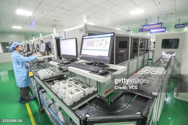 An employee works on the production line of smart electric meters at a workshop of the Hangzhou Xili Intelligent Technology Co., Ltd. On April 2,...