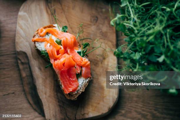 salmon salted sandwich with spinach and cream cheese, top down view - crostini stock pictures, royalty-free photos & images