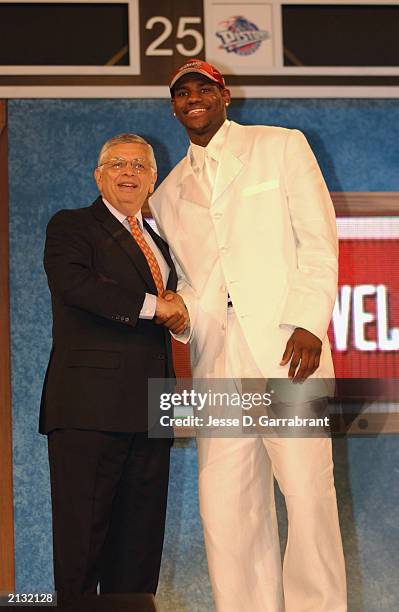 LeBron James who was selected by the Cleveland Cavaliers shakes hands with NBA Commissioner David Stern during the 2003 NBA Draft at the Paramount...