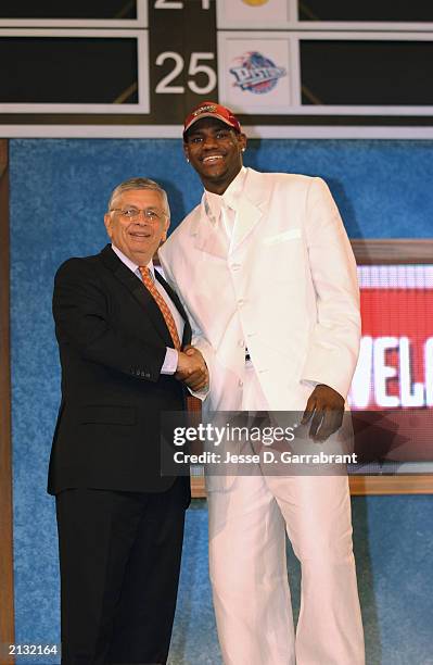 LeBron James who was selected by the Cleveland Cavaliers shakes hands with NBA Commissioner David Stern during the 2003 NBA Draft at the Paramount...