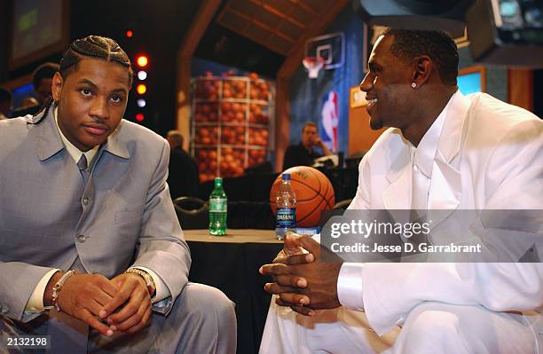 Carmelo Anthony and LeBron James talk during the 2003 NBA Draft at the Paramount Theatre at Madison Square Garden on June 26, 2003 in New York, New...