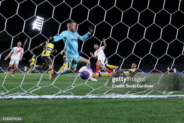 Tolgay Arslan of Melbourne City scores a goal as Danny Vukovic of the Mariners looks on during the A-League Men round 21 match between Central Coast...