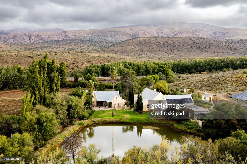 Solar photovoltaic panels generate renewable energy on the roof of a farmhouse in the Karoo, South Africa