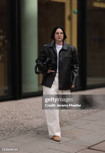 Maria Barteczko seen wearing Ray-Ban gold round retro glasses, Source Unknown black woven leather jacket, Arket white cotton basic t-shirt, Source...