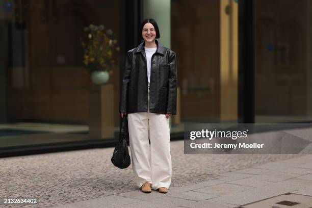 Maria Barteczko seen wearing Ray-Ban gold round retro glasses, Source Unknown black woven leather jacket, Arket white cotton basic t-shirt, Source...