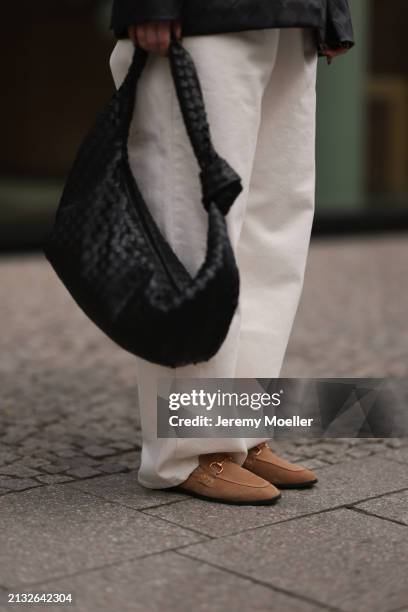 Maria Barteczko seen wearing Source Unknown black woven leather jacket, Source Unknown ecru / creamy white wide leg jeans, Asos black leather woven...
