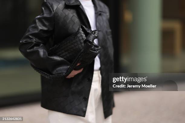 Maria Barteczko seen wearing Source Unknown black woven leather jacket, Arket white cotton basic t-shirt, Source Unknown ecru / creamy white wide leg...