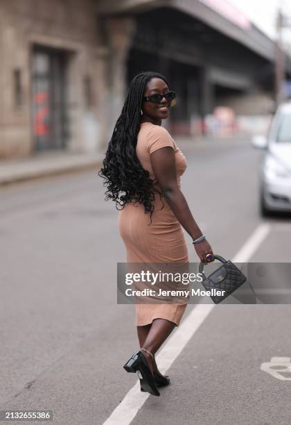 Lois Opoku seen wearing Chanel black bag, ASOS black patent heels, ASOS beige brown dress, ASOS golden earrings, The Attico x Linda Farrow black...