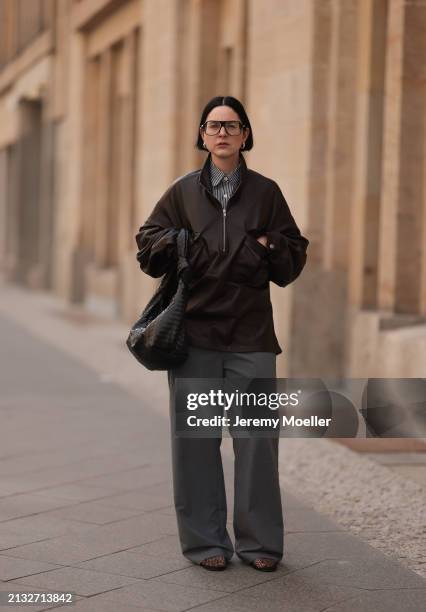 Maria Barteczko seen wearing Victoria Beckham black oversized Aviator glasses, The Frankie Shop brown leather windbreaker / bomber leather jacket,...