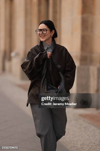 Maria Barteczko seen wearing Victoria Beckham black oversized Aviator glasses, The Frankie Shop brown leather windbreaker / bomber leather jacket,...